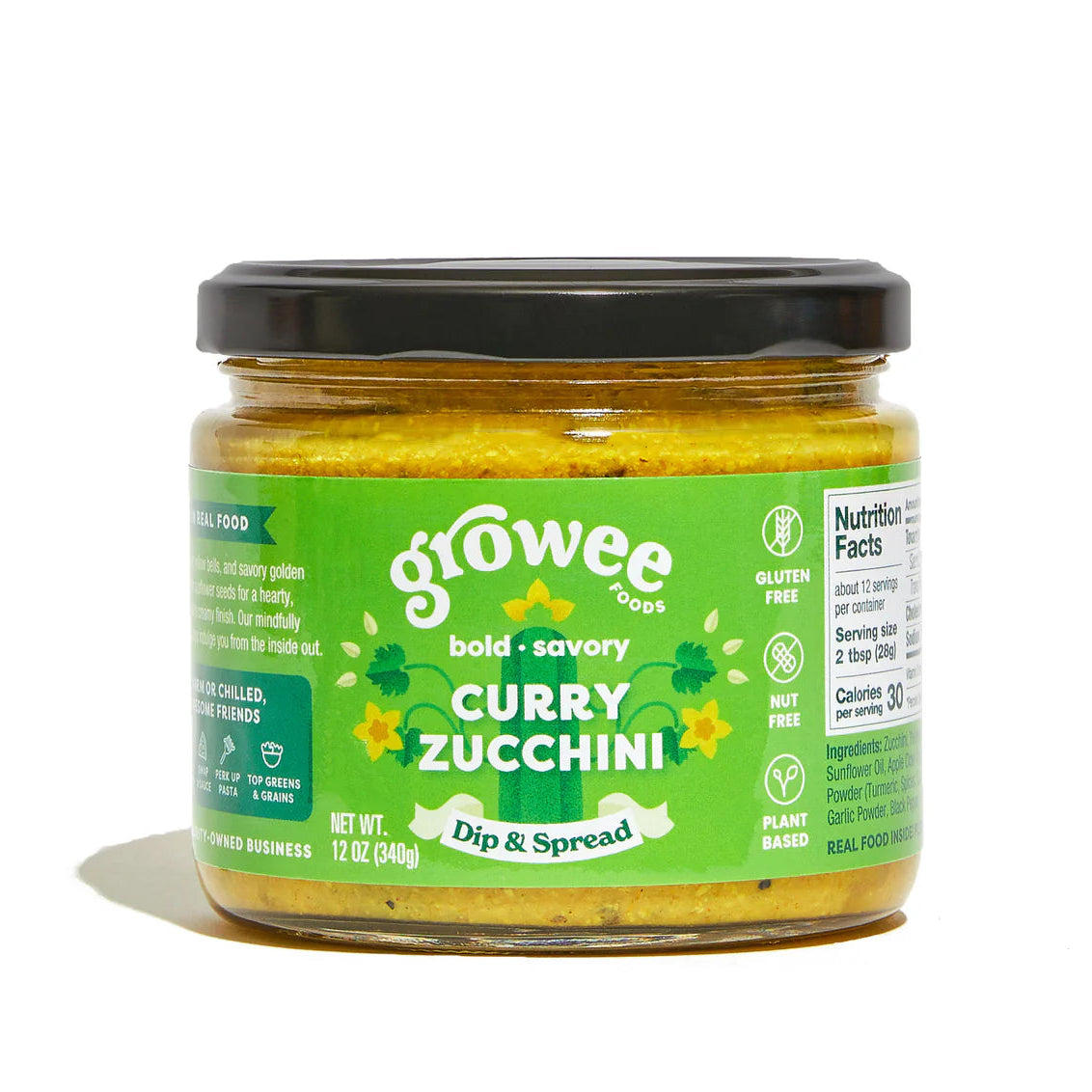 Jar of growee curry zucchini dip on a white background