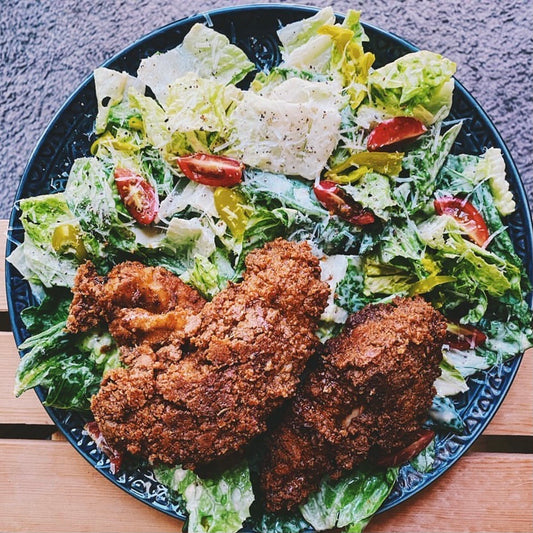 Jerked & Fried Bourbon-Maple Chicken Caesar Salad