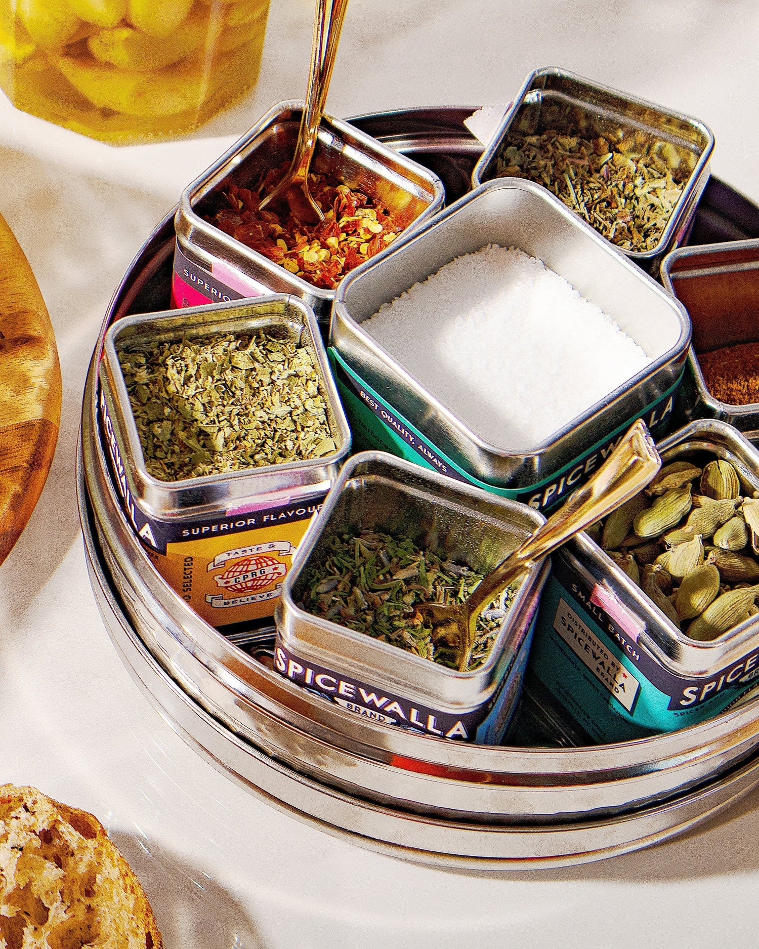 Dubba holding different Spicewalla tins