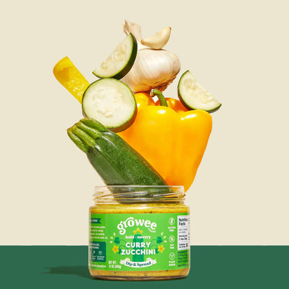 Jar of 'Growee' baby food with vegetables on a beige background