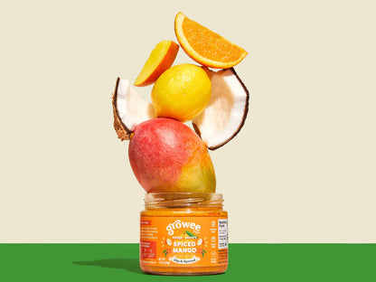 Jar of 'growee' baby food with fruits on a beige and green background