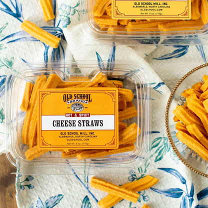 Old School Mill cheese straws in packaging on a patterned tablecloth