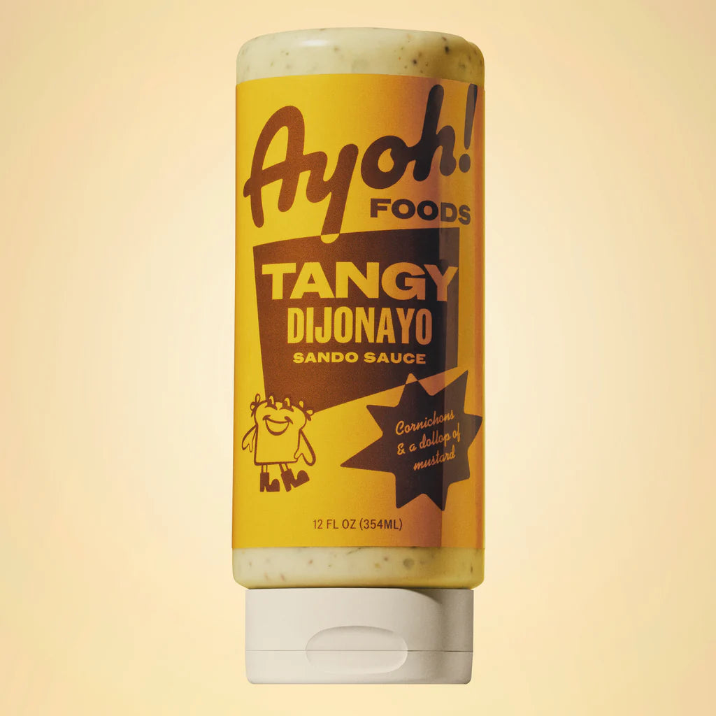 Ayoh! Foods Tangy Dijonayo Sando Sauce bottle on a beige background