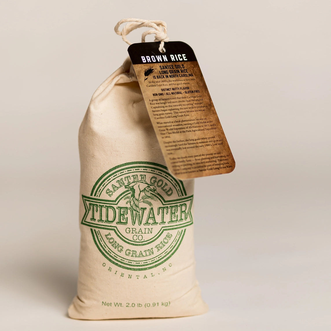 Bag of Widewater Grain brown rice with a tag on a beige background